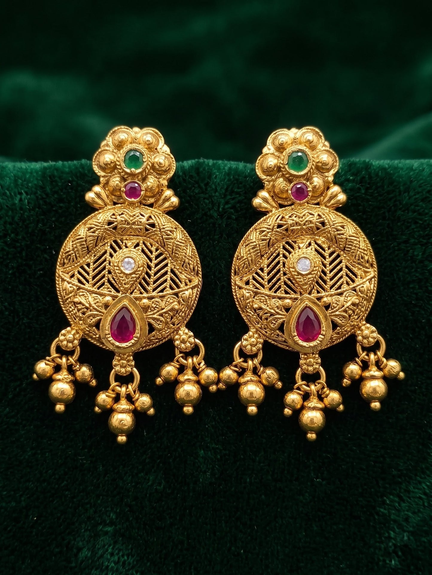 Matching antique gold Rajwadi earrings from Trishika longset collection