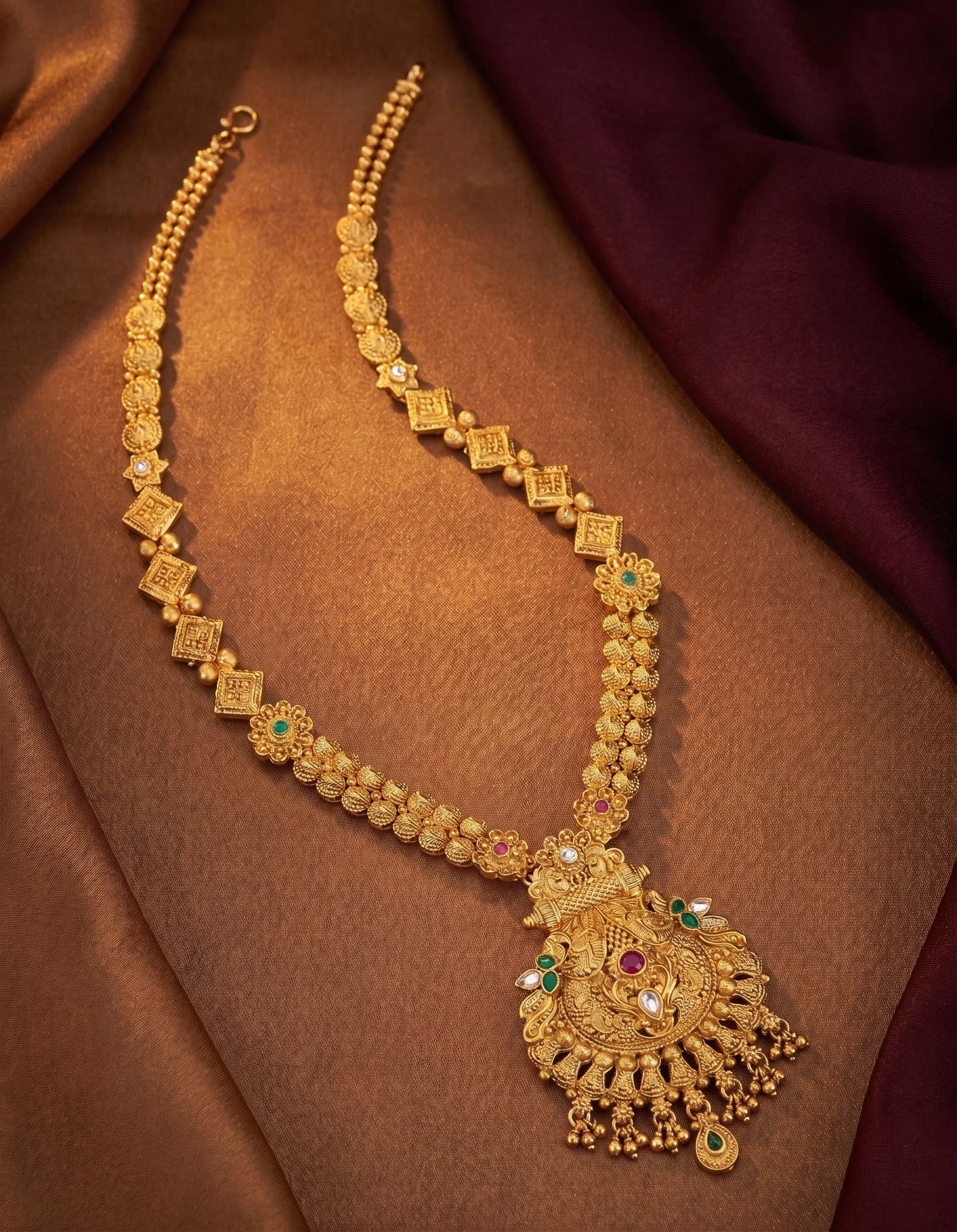 Ethnic imitation long necklace set with pendant in antique gold polish