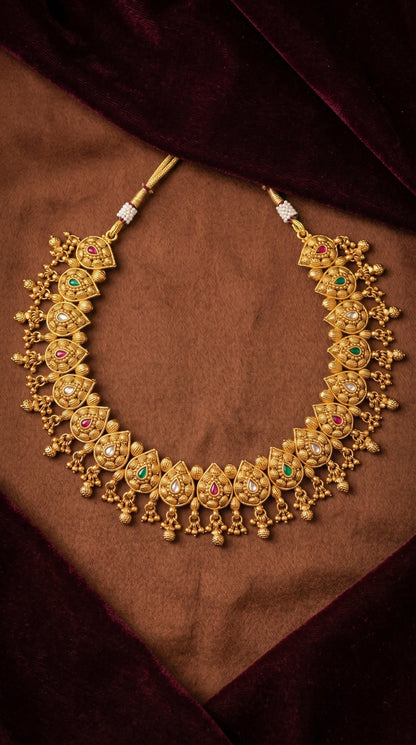 Traditional gold look necklace set for wedding and festive wear displayed