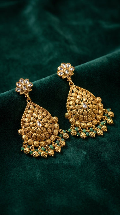 Matching earrings from Manjusha gold look artificial jewellery set
