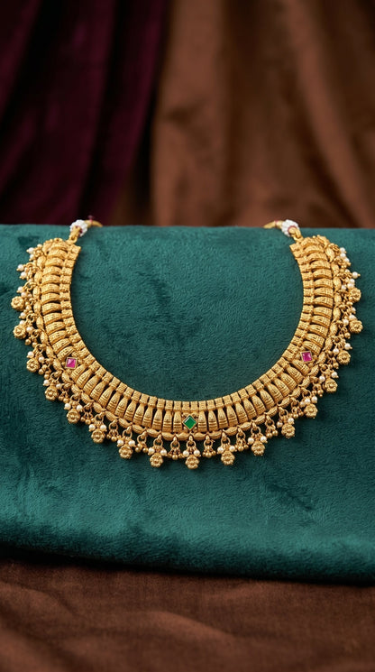 Traditional gold look necklace set for wedding and festive wear laid out
