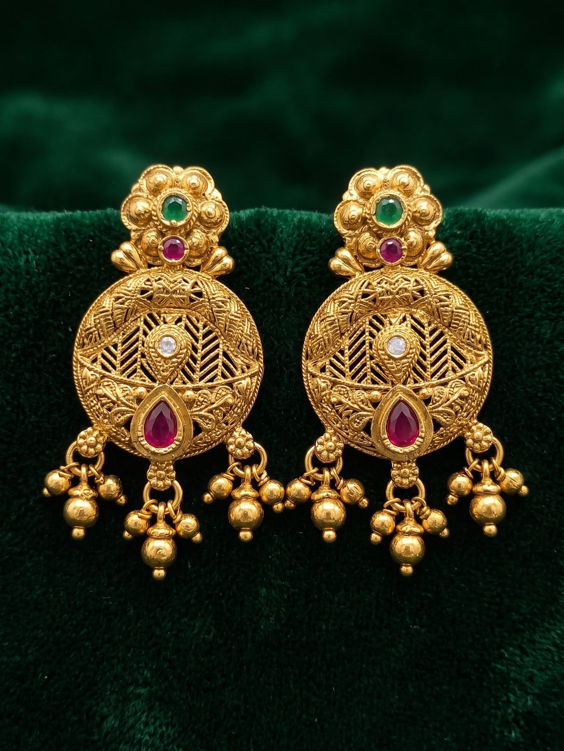 Matching antique gold Rajwadi earrings from Trishika longset collection