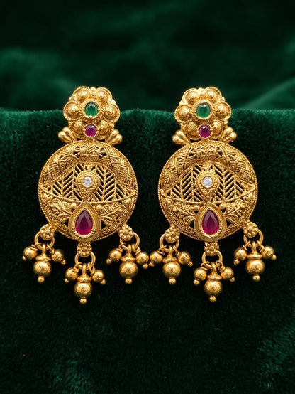 Matching antique gold Rajwadi earrings from Trishika longset collection
