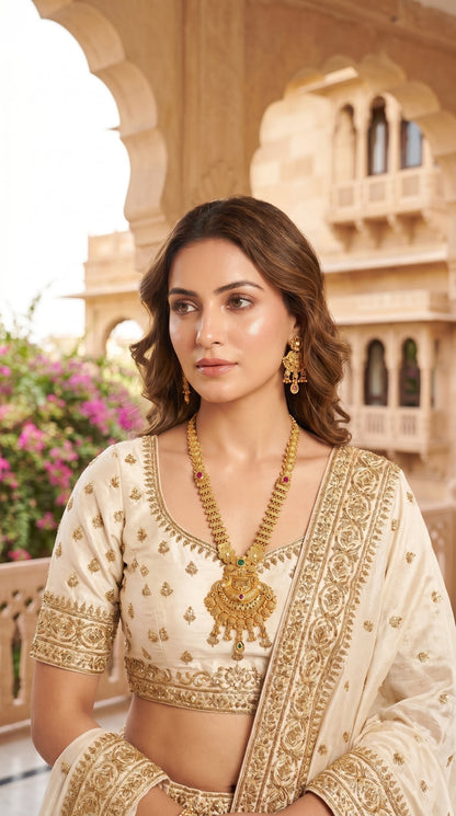 Woman wearing Urvi Rajwadi long necklace set with ethnic bridal outfit